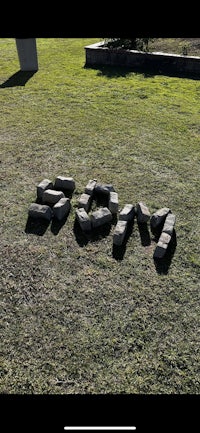 a grassy field with the word moo written on it