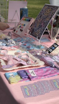 a pink table with a lot of items on it